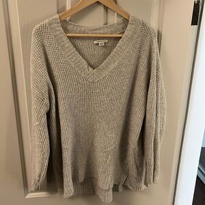 Soft, stretchy relaxed fit v-neck sweater.
